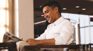 A business man reading a newspaper.